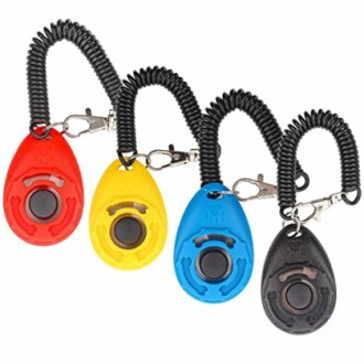 Colorful dog training clickers with wrist straps.