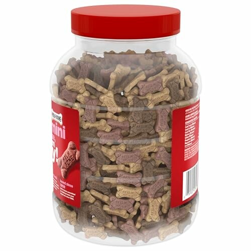 Jar of assorted dog biscuits with red lid