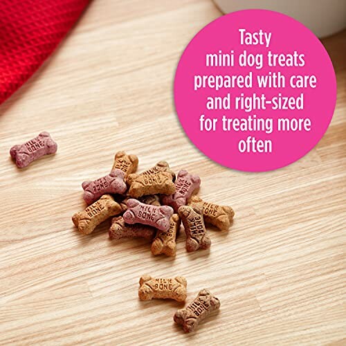 Mini dog treats on a wooden surface with a pink circle highlighting their tastiness and right size.